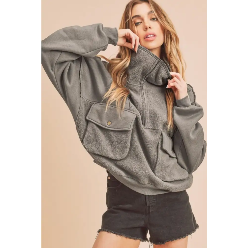 Exposed Seam Half Zip Sweatshirt with Pockets.