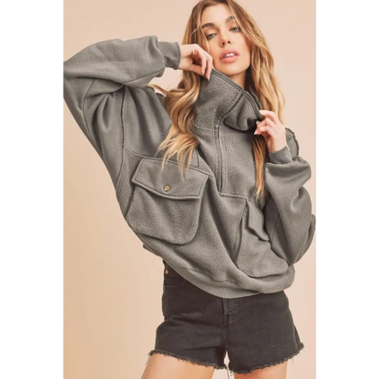 Exposed Seam Half Zip Sweatshirt with Pockets.