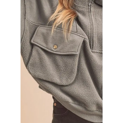 Exposed Seam Half Zip Sweatshirt with Pockets.