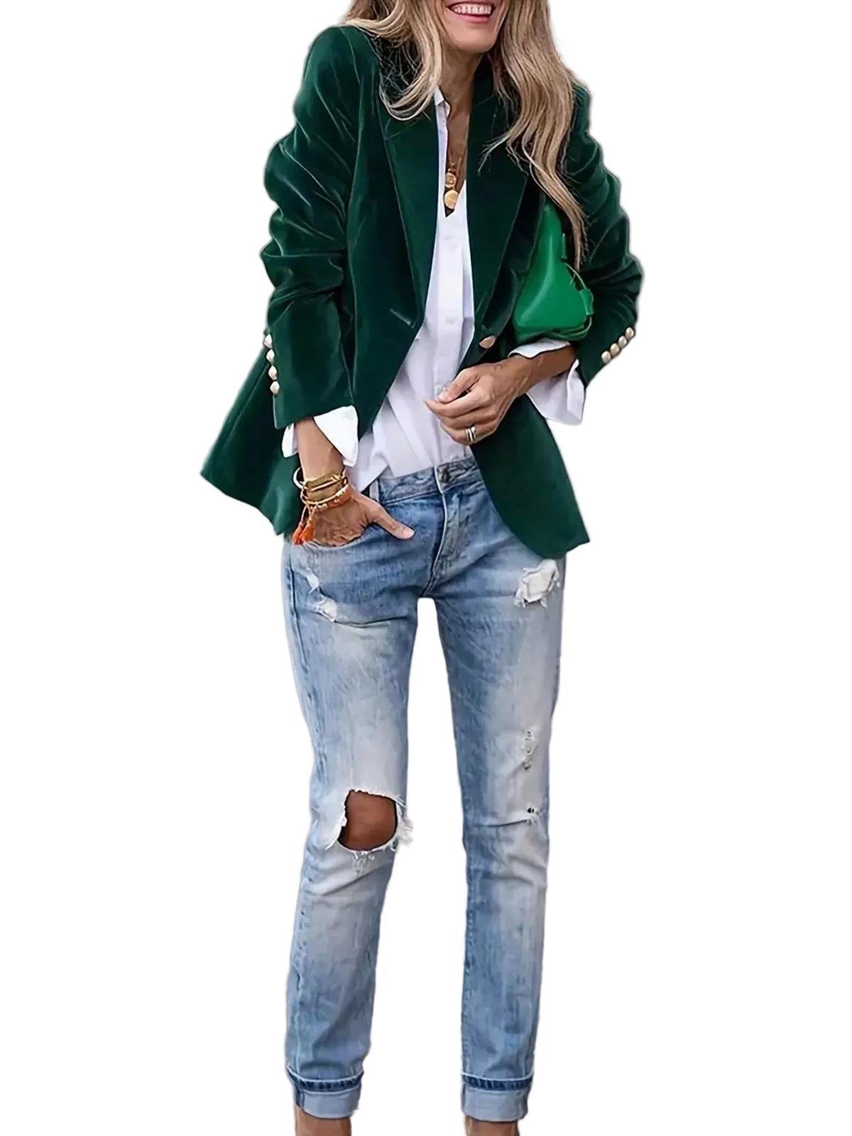 Woman wearing a green blazer, white shirt, and ripped jeans on a street.