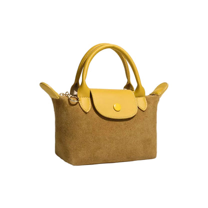 A structured yellow handbag with a suede-like body, yellow leather handles, and a yellow snap-button flap, photographed on a clean light gray background.