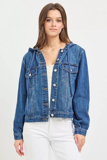 Woman wearing a blue denim jacket on a white background