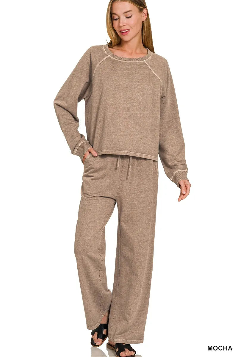 Woman wearing a brown lounge set on a white background