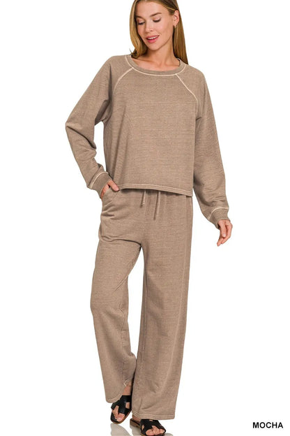 Woman wearing a brown lounge set on a white background