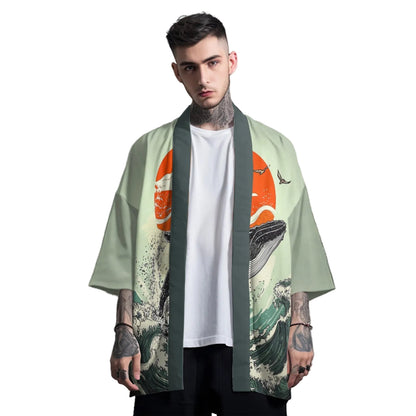 Man wearing a kimono-style garment with whale design on a gray background