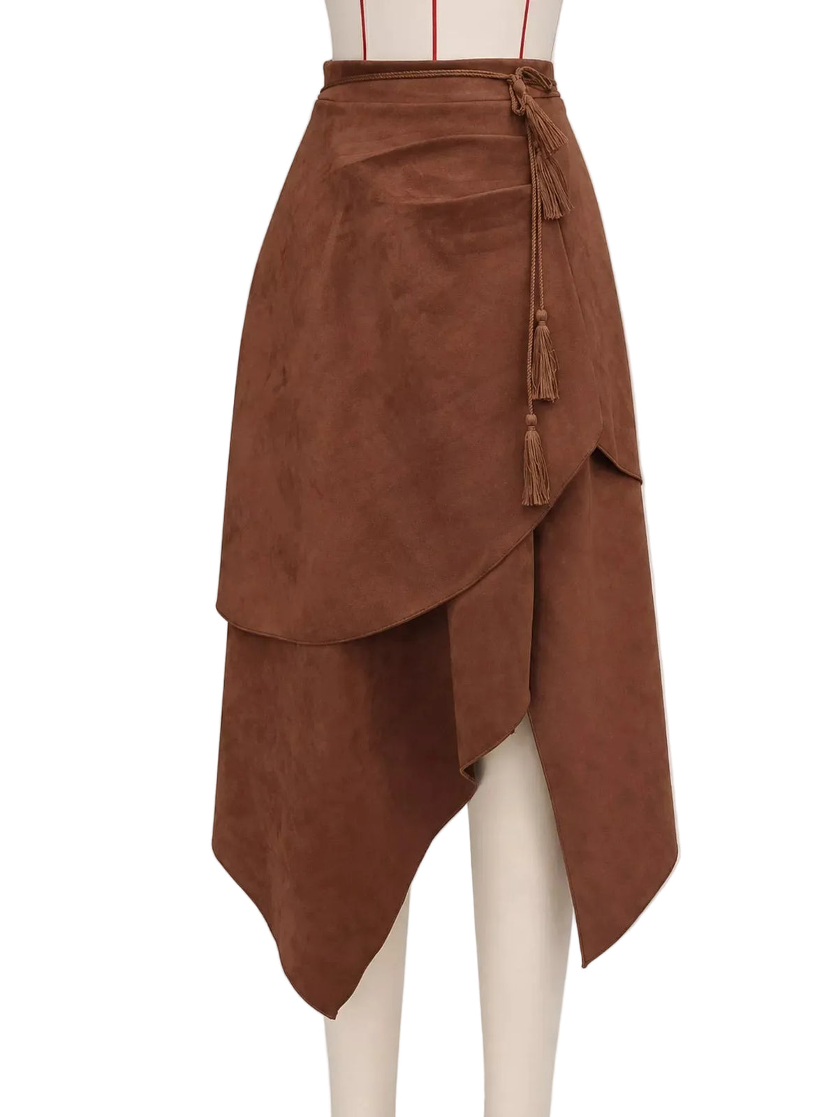 A brown faux suede wrap skirt with an asymmetrical layered hem and tassel tie at the waist, displayed on a cream mannequin against a light gray background.