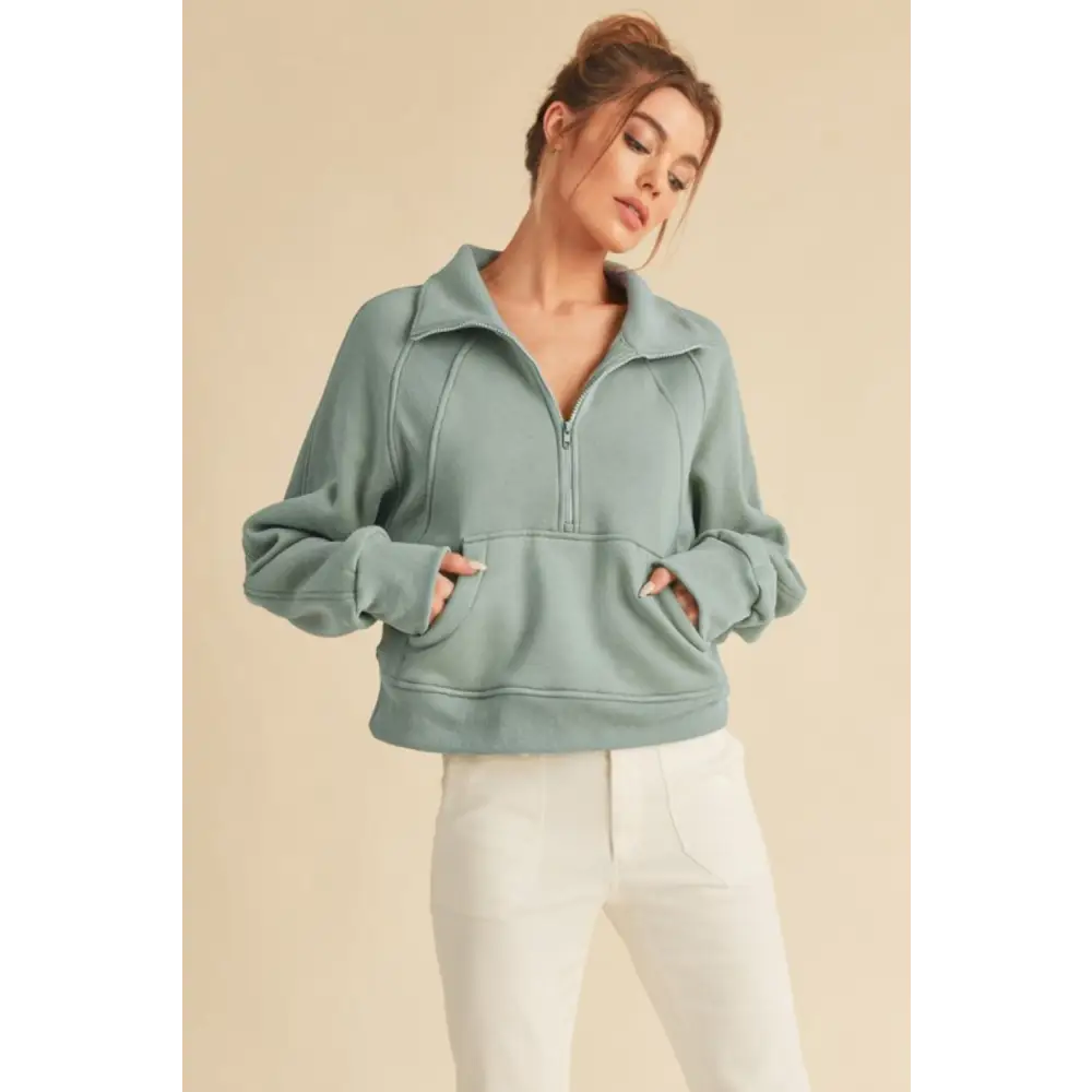 Half Zip Raglan Sleeve Hoodie with Kangaroo Pocket.
