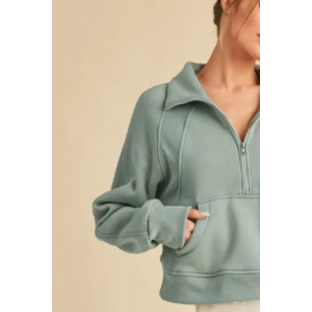 Half Zip Raglan Sleeve Hoodie with Kangaroo Pocket.