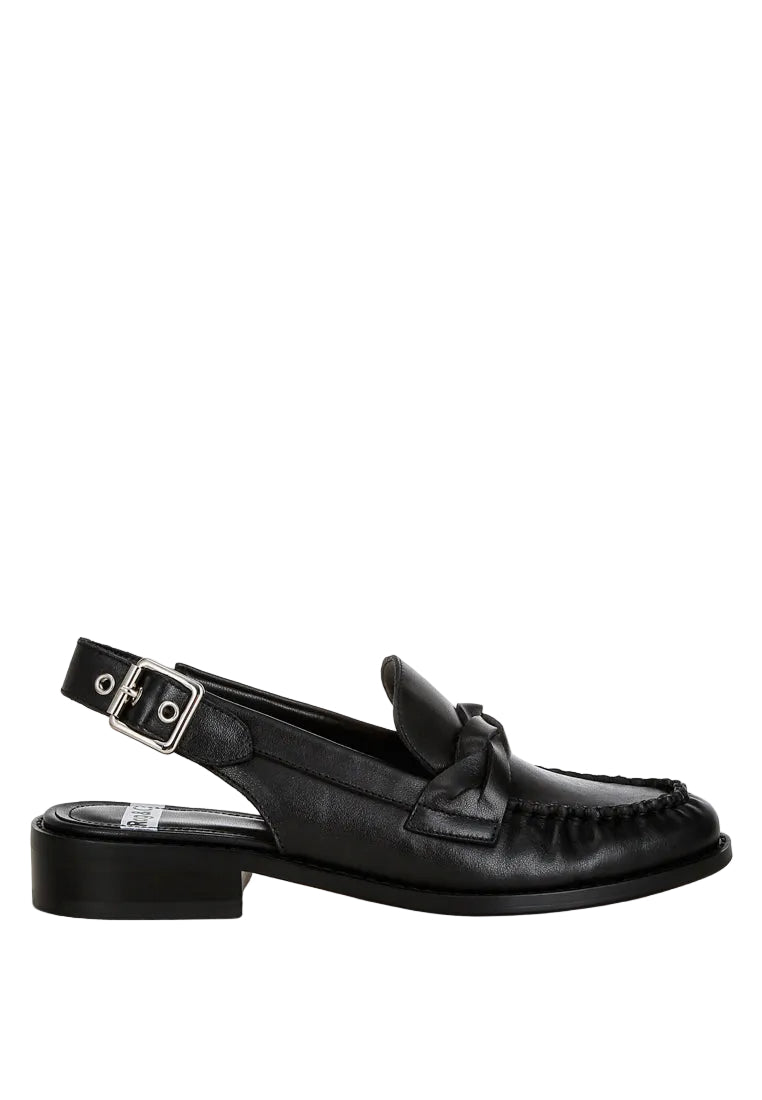 Black loafer with a strap on a white background