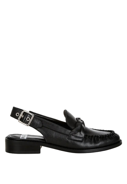 Black loafer with a strap on a white background