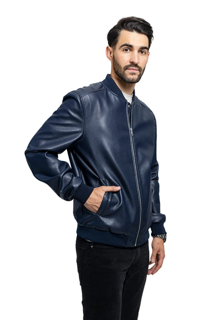 Man wearing a navy leather bomber jacket on a light gray background