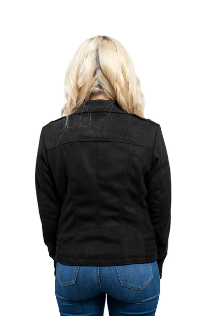 Person wearing a black jacket and blue jeans on a gray background