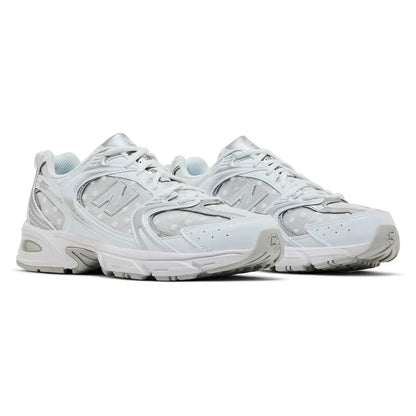 New Balance 530 sneakers in White Silver Metallic with polka dots