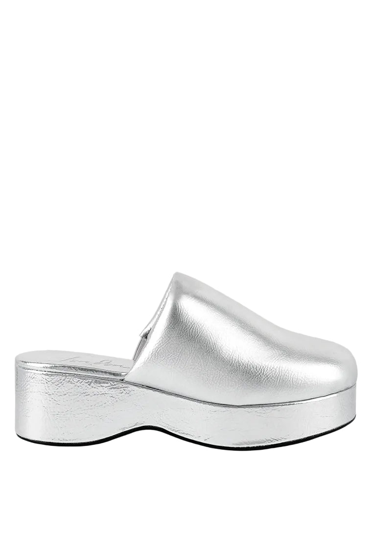 Silver clog shoe on a light gray background