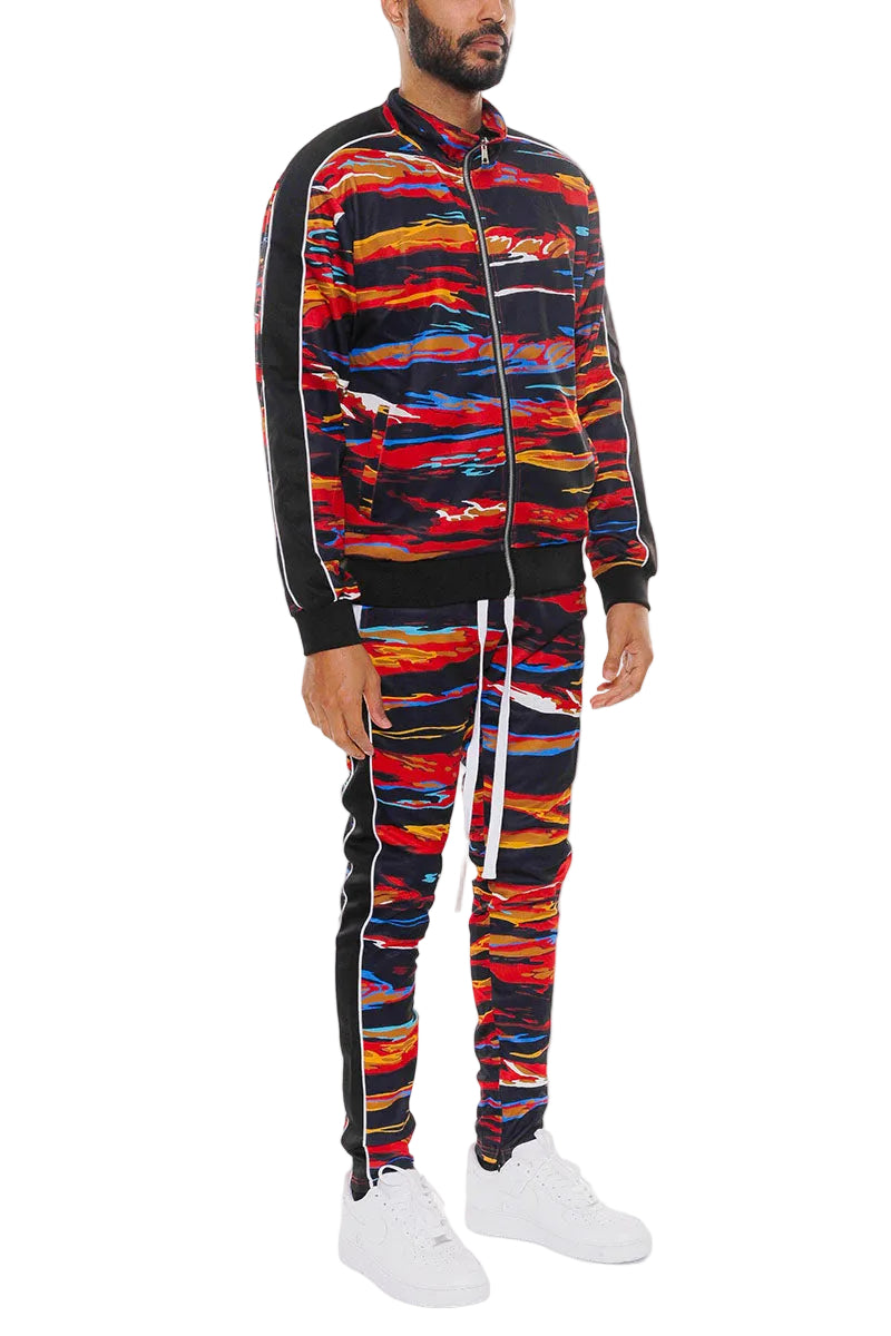Person wearing a colorful tracksuit with a white background