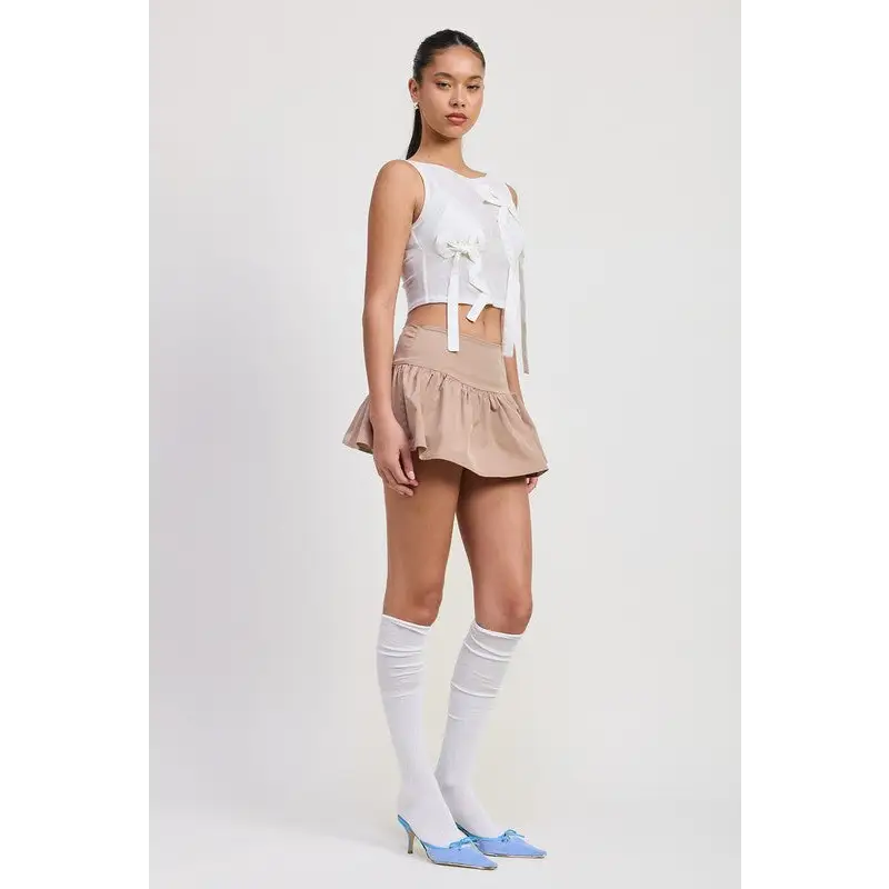 Sleeveless Sheer Bow Top.