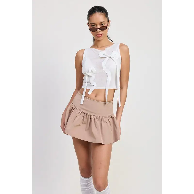 Sleeveless Sheer Bow Top.
