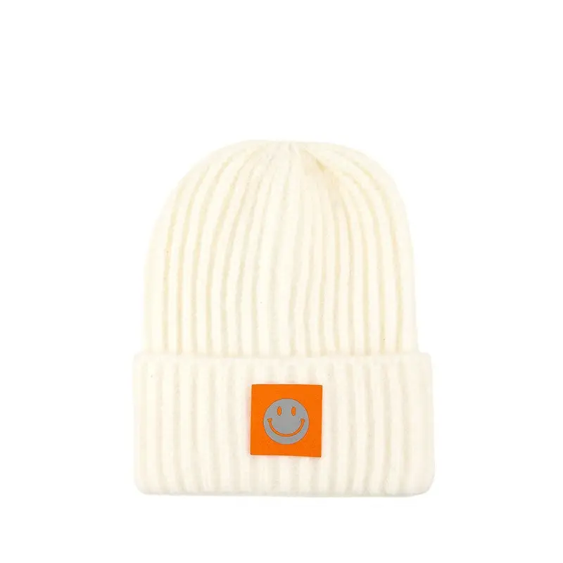 Solid Rib Beanie with Smile Accent.