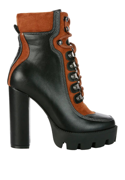 Black platform boot with brown accents on a white background