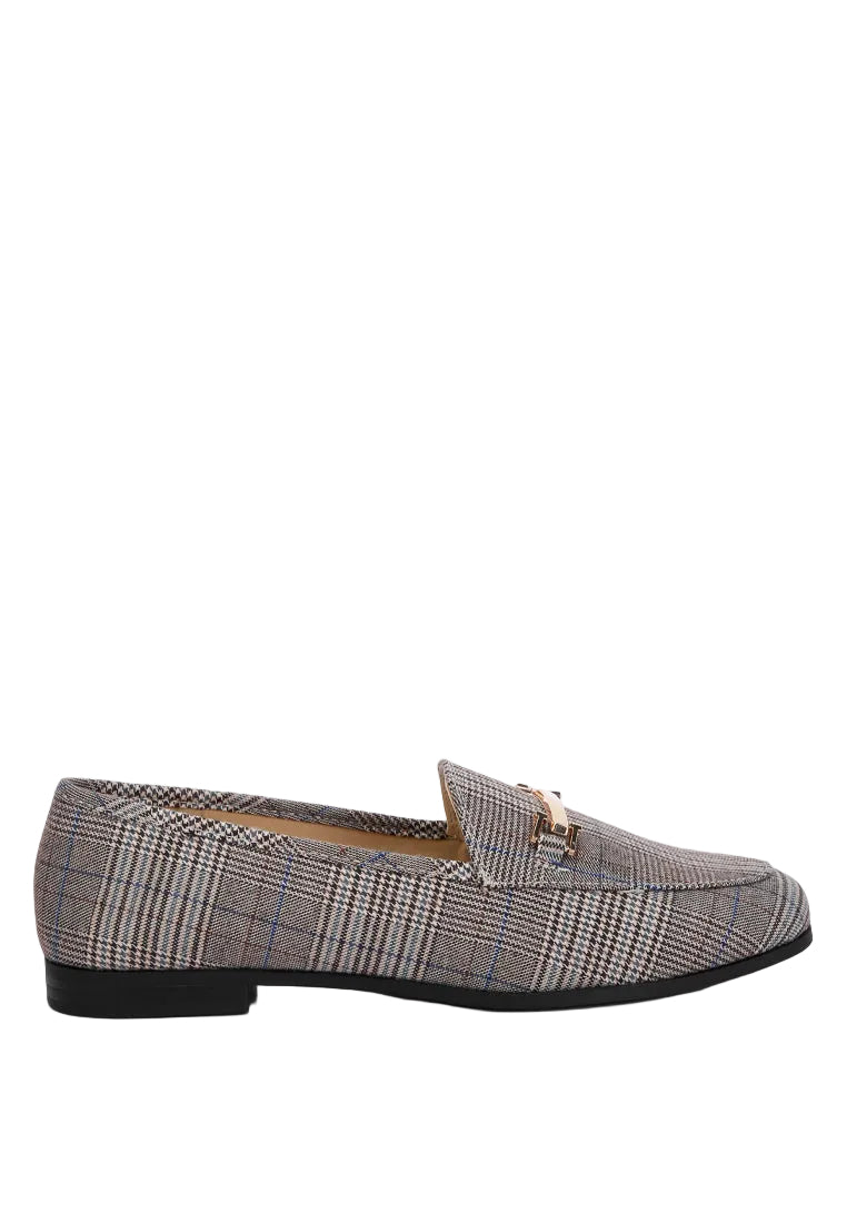 A single men's loafer in a brown, beige, and gray plaid pattern with a small gold-tone horsebit detail on the vamp, shown in a side profile against a light gray background.